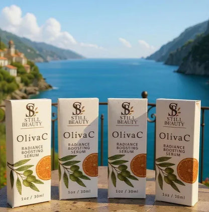 Four pack of Still Beauty OlivaC radiance boosting serum bottle boxes with scenic Mediterranean background of a coastal town and blue sea.